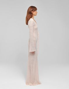 Materials: Knit nylon cottonColors: PinkDescription: Knitted long dress featuring front cut-outs and strap detailDetails Long dress Cut out upfront with strap detail V neck Long sleeves Model wearing: SMADE IN ALBANIA BUST WAIST HIPS (cm)XS 84 64 94S 88 68 98M 94 72 102L 102 78 106XL 108 84 110CUSTOM SIZE: We can make any design custom based on your measurements. Customization is offered also about color and some design. Feel free to write us a message. Fitted Chic Maxi Dress With Open Knit Details, Spring Evening Knit Maxi Dress, Spring Party Crochet Maxi Dress, Fitted Open Knit Maxi Dress, Spring Maxi Length Open Knit Crochet Dress, Spring Open Knit Maxi Crochet Dress, Chic Open Knit Maxi Dress, Spring Open Knit Maxi Dress, Chic Spring Open Knit Maxi Dress