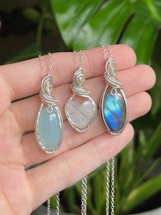 "💙🌊 Ocean Blues Crystal Necklaces 🌊💙 * Wrapped in Sterling Silver wire✨ Chalcedony: 1 1/2\" tall Rainbow Moonstone: 1 5/16\" tall Labradorite: 1 1/2\" tall  * Each necklace comes with an 18\" Sterling Silver chain  🌿 Follow me on Instagram & TikTok @crystal.lune" Bohemian Sterling Silver Crystal Necklace, Bohemian Sterling Silver Crystal Necklace With Gemstone, Bohemian Sterling Silver Crystal Gemstone Necklace, Silver Labradorite Necklace With Gemstone Beads, Handmade Dainty Moonstone Crystal Necklaces, Dainty Silver Crystal Necklaces As Gift, Handmade Moonstone Dangle Necklace, Nickel Free Labradorite Jewelry As Gift, Nickel-free Labradorite Jewelry As Gift