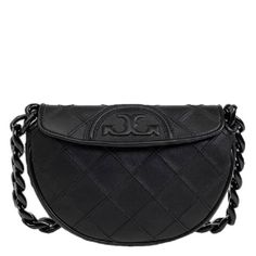 Tory Burch Crossbody. SKU: 162265-001. Color: Black. Size: W: 9" x D: 1.9" x H: 5.9". Tory Burch Black Leather Fleming Soft Mini Crescent Bag. This crescent-shaped bag features a textured diamond pattern, an iconic trapunto logo, and a bold chain-link shoulder strap, with a magnetic-snap flap closure, a removable and adjustable crossbody strap, and an interior wall pocket. Outer: Calf Leather 100%. Crescent Bag, Tory Burch Crossbody, Versace Watch, Denim Shoes, Crossbody Messenger Bag, Mini Handbags, Mini Shoulder Bag, Black Crossbody, Interior Wall