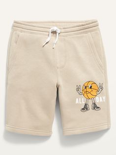 Elasticized waistband, with interior drawstring.  Diagonal front pockets, with jersey lining.  Faux fly.  Soft, garment-washed fleece.  Easy pull-on style.  Sits at waist.  Straight hip and thigh.  Boys jogger shorts hit above knee. Machine wash cold