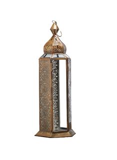 a large metal lantern with an intricate design on the top and bottom, sitting against a white background