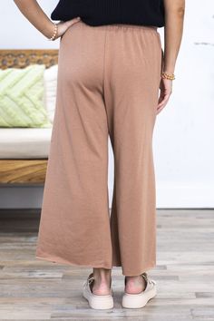 Product Details Color/Wash: Mocha Rise: High Rise Style: Pull On Elastic Tie Waist Brand: First Love Material and Care 87% Cotton 9% Rayon 4% Spandex Machine Wash Warm Tumble Dry Low Size and Fit Small: Waist 28" Rise 12.5" Inseam 23.5" Medium: Waist 30" Rise 13" Inseam 23.5" Large: Waist 32" Rise 13.5" Inseam 24" Photo model is 5'4 and wearing a size small Video model is 5’8 and wearing size small Stretch Brown Bottoms For Loungewear, Brown Stretch Bottoms For Loungewear, Brown Full-length Yoga Bottoms, Stretch Brown Pants With Elastic Waistband, Brown Stretch Pants With Elastic Waistband, Stretch Brown Wide Leg Pants For Loungewear, Versatile Stretch Brown Pants, Brown Stretch Ankle-length Wide Leg Pants, High-waist Brown Bottoms For Loungewear