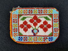 "A very nice handmade beaded coin purse/money pouch. Stylized with floral and nice patterns. Fully handmade. Beadwork / Beadart. Very good condition. You can tell its age by the colors and the fineness of the beadwork. Sizes approximately: 3.75\" x 2.95\" 9.5 cm x 7.5 cm Photos were taken in natural daylight. Thank you for visiting my shop. Please don't hesitate to contact me for more information... Your purchased items will be securely packaged and delivered to FedEx. If items are purchased dur Traditional Beaded Rectangular Pouch, Multicolor Beaded Rectangular Coin Purse, Beaded Pouch Coin Purse, Everyday Multicolor Beaded Coin Purse, Multicolor Beaded Pouch Coin Purse, Multicolor Beaded Coin Purse Pouch, Multicolor Beaded Rectangular Pouch, Nice Patterns, Beaded Coin Purse