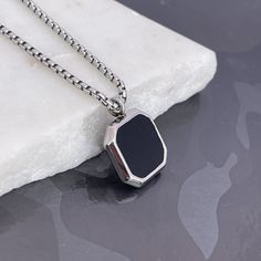 "Elevate her style with our Black Onyx Stone Necklace for Men, a stainless steel pendant ready for custom engraving. The perfect gift designed for her, these handmade jewelry pieces add sophistication to any look. Express your love with a special message, initials, or date, and make it a special treasure. Convey individuality and charm with a timeless piece. Presented in a durable and stylish style, this makes a lovely Valentine's Day gift for a husband or lover. \"Personalize Your Style\" and m Stainless Steel Round Pendant Jewelry With Polished Finish, Polished Stainless Steel Round Pendant Jewelry, Modern Dog Tag Jewelry For Gifts, Black Personalized Dog Tag Necklace, Father's Day Black Dog Tag Jewelry, Modern Silver Necklace With Black Enamel, Black Metal Necklace With Polished Finish, Gunmetal Stainless Steel Jewelry With Chain, Classic Stainless Steel Necklace With Rectangular Pendant