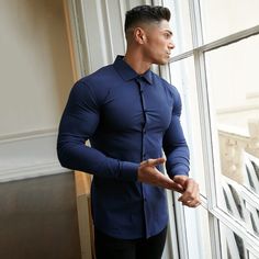 Stretch Cotton Long Sleeve Shirt, Stretch Long Sleeve Shirt, Fitted Collared Sports Shirt, Fitted Casual Sports Shirt, Fitted Collared Shirt For Sports, Fitted Cotton Sports Shirt, Cotton Long Sleeve Gym Tops, Casual Long Sleeve Sports Shirt, Blue Fitted Sports Shirt