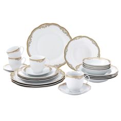 a set of white and gold dinnerware