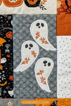 two ghost appliques on the side of a quilt