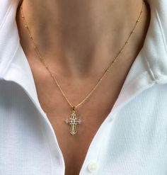 Womens Cross necklace, gold filled cross necklace, gold cross necklace, dainty jewelry, gifts for her, religious necklace, birthday gift Gold filled cross necklace  D E T A I L S: *1"  Gold filled cross pendant with Cubic Zirconia Stones *Gold filled Satellite or Cable chain- choose your perfect length at checkout  *Model wearing 18" length  Water & tarnish resistant!  Gold filled jewelry is durable & tarnish resistant.  Gold filled quality products are suitable for daily wear and is also water Gold Cross Charm Necklaces In 14k Gold Filled, Everyday 14k Gold Filled Cross Pendant Necklace, Yellow Gold Cross Necklace With Delicate Chain, 14k Gold Delicate Chain Cross Necklace, 14k Gold Cross Necklace With Delicate Chain, 14k Gold Filled Cross Pendant Necklace As Gift, 14k Gold Filled Cross Necklace Gift, 14k Gold-filled Gold Cross Pendant Necklace, Gold Cross Pendant Necklace In 14k Gold Filled