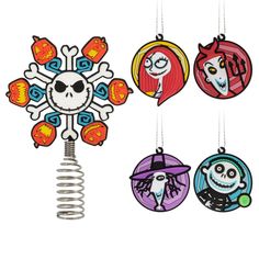 four ornaments hanging from the ceiling with different designs on them, all decorated in cartoon style