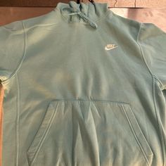 Teal Nike Hoodie Never Worn Nike Hoodie With Ribbed Cuffs For Spring, Nike Crew Neck Hoodie For Spring, Nike Casual Sweatshirt With Drawstring Hood, Nike Casual Hoodie With Drawstring Hood, Casual Nike Hoodie Sweatshirt, Urban Style Blue Hooded Top, Blue Hooded Urban Top, Nike Hoodie Sweatshirt With Pockets, Urban Blue Hooded Top