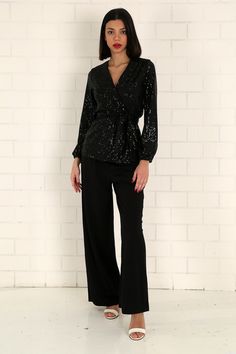 "The black sequined wrap blouse has a modern and stylish look. Our glamorous blouse with its sparkle is an extremely stylish and elegant choice for formal evenings such as cocktails, weddings and all-night/day invitations. The blouse, which is a coupon piece that you should have in your closet, can be combined with sequined twin trousers, baggy and tight classic trousers or jeans. It easily adapts to your body with the shawl model. It is tied around the waist with a belt. S/36 Length from underarm: 43cm/16.9\" Length from Shoulder: 66cm/25.9\" M/38 Length from underarm: 44cm/17.3\" Length from Shoulder: 67cm/26.4\" L/40 Length from underarm: 45cm/17.7\" Length from Shoulder: 68cm/26.8\" XL/42 Length from underarm: 46cm/18.1\" Length from Shoulder: 69cm/27.2\" 2XL/44 Length from armpit: 47c Glamorous Glitter Blouse For Night Out, Elegant V-neck Tops For Festive Occasions, Fitted Sequined V-neck Blouse, Fitted V-neck Sequin Blouse, Glamorous V-neck Cocktail Tops, Glitter Blouse For Night Out In Fall, Glitter Blouse For Night Out Party Season, Fall Glitter Blouse For Night Out, Glitter Blouse For Night Out