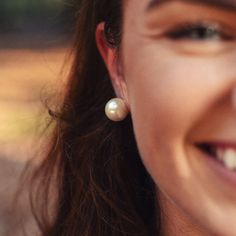 Pearl earrings, an iconic nautical piece of jewelry suitable for every occasion, no matter how far inland you may be. Found on the ocean floor under the tight grasp of an oyster shell. Proclaim your love for the ocean with these elegant earrings.Product Details: Signature KJP Anchor Clutch 14k Gold Plated Lustrous Simulated Pearl 14mm wide Made in America Gift Box Included Everyday Pearl White Earrings, Nickel Free Pearl Earrings For Anniversary, Nickel Free Pearl Earrings For Gift, Nickel-free Pearl Earrings For Gift, Everyday Round Pearl Earrings, Pearl White Nickel-free Earrings, Ocean Floor, On The Ocean, Oyster Shells