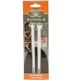 two white tools in packaging on a white background