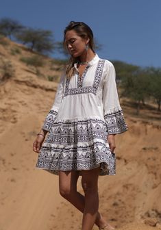 This gorgeous free size off white and black block print cotton smock Boho summer beach dress has a lovely clean crisp fresh and natural vibe. Its ultimate boho hippie fashion , sustainably clothing that's gentle on the skin and the environment. Its made from pure cotton. Each piece is individually hand printed with vegetable dye using the ancient and timeless technique of block printing for that lovely earthy mottled finish that feels so organic, wholesome and unique. A perfect go to cotton summ Printed Mini Boho Dress For Vacation, White Bohemian Sundress For Vacation, Black Cotton Tunic For Summer, White Bohemian Printed Mini Dress, Bohemian White Printed Mini Dress, White Bohemian Mini Dress With Print, White Tunic Mini Dress For The Beach, White Bohemian Mini Length Beach Dress, Flowy White Boho Dress For Vacation