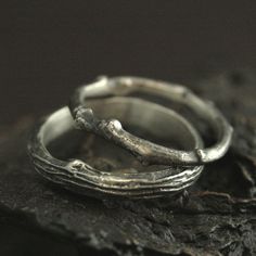 Bands Outdoors Rings Silver Twig Bands Tree Rings Bark Bands Branch Rings Nature Wedding Bands Men's Wedding Ring Women's Wedding Band Express your love for one another and your mutual love of nature with this unique wedding set. Your rings will be hand made to size upon their purchase from solid sterling silver twigs that are created by molding and casting REAL twigs. We then oxidize and brush them to highlight their natural beauty. The wider band measures between 4mm to 5mm wide by 2mm to 2.5m Rustic Hand Forged Wedding Rings, Sterling Silver Wedding Jewelry With Ring Detail, Heirloom Wedding Rings Adjustable Fit, Heirloom Adjustable Wedding Rings, Heirloom Wedding Rings With Adjustable Fit, Rustic Hand Forged Rings For Anniversary, Nature-inspired Sterling Silver Wedding Rings, Nature-inspired Sterling Silver Wedding Jewelry, Hand Forged Ring Jewelry For Wedding