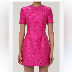 A Feast For The Eyes, This Statement Floral Dress Stands Out Among Our Hot Pink Dresses. It Features A Round Neck And Short Sleeves, Cinched At The Waist With A Slightly Flared Skirt And A Discreet Back Zipper. The Exquisite Cotton Blend Jacquard Fabric, Enhanced With Lurex, Lends A Luxurious Golden Sheen To The Floral Patterns, Accentuated By Sparkling Sequins For A Cute Yet Dazzling Touch. Perfect With A Blazer, This Meticulously Tailored Short Dress From Our Boutique Is Ideal For Elegant Dinn Pink Jacquard Dress, Luxury Fitted Evening Dress With Short Sleeves, Luxury Fitted Short Sleeve Evening Dress, Fitted Silk Mini Dress Embellished, Silk Sheath Evening Dress For Party, Pink Jacquard Evening Dress, Luxury Sheath Party Dress, Luxury Sheath Dress For Party, Pink Jacquard Summer Dress