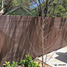 a fence that is made out of wood and has an intricate design on it's side