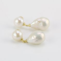 I made the earrings with 8mm and 10-11mm ivory color drop pearls with 925 silver Item No:ERS242 Item : real freshwater baroque pearl earrings Pearl shape: drop shape Big Pearl size:10-11mm Small pearl size:around 8mm Pearl color: ivory white Pearl skin:clean Pearl quality:AA Pearl luster: good Metal:silver Packing: beautiful gift box,ready for gift giving Please contact Lisha freely if you have any specific demand or need custom order, I will always try my best to meet your request. Classic High Luster Drop Pearl Earrings, White Drop Pearl Earrings For Anniversary, White Pear-shaped Pearl Earrings With Pendant, White Pear-shaped Pearl Pendant Earrings, White High Luster Drop Pearl Earrings, Anniversary White Drop Pearl Earrings, White Drop Pearl Earrings, Classic Briolette Pearl Drop Earrings, White Drop Pearl Earrings With Pendant