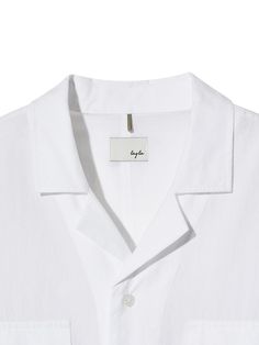 The shirt is made of lightweight, breathable, and soft washed cotton fabric. The open collar creates relaxed and comfy mood. Stitched using silky thread, the shirt has more sophisticated look. The shirt has two pockets on the font and 3-stitching from armhole to hem.- Button closure- Open collar- YKK Code Lock, drawcords on the hem- Chest flap pockets- Logo engraved buttons Summer Shirt With Lapel Collar And Placket Detail, Summer Shirt With Lapel Collar And Placket, Lapel Collar Shirt With Placket For Summer, Summer Camp Shirt With Placket And Lapel Collar, Classic Camp Shirt With Lapel Collar For Spring, Summer Shirt With Lapel Collar For Everyday, White Lapel Collar Cotton Shirt, White Cotton Shirt With Lapel Collar, Everyday Summer Shirt With Lapel Collar