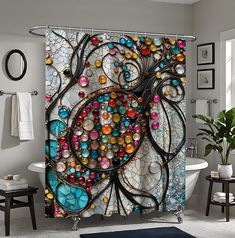 a bath room with a tub and a shower curtain covered in colorful glass beads on the wall