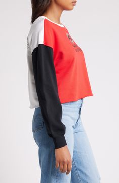 The Women's WEAR by Erin Andrews Heather Red Toronto Raptors Mixed Letter Cropped Pullover Sweatshirt is the perfect way to show your support for the Toronto Raptors. This midweight sweatshirt is made from a soft cotton and polyester blend, making it comfortable to wear all day long. The cropped, unfinished hem and embroidered graphics give it a stylish look that will turn heads. Whether you're cheering on the Raptors at the game or just hanging out at home, this sweatshirt is sure to become a f Trendy Red Cotton Sweatshirt, Trendy Red Cotton Sweater, Trendy Red Crew Neck Sweatshirt, Sporty Color Block Top For Fall, Sporty Fall Tops With Color Block, Red Color Block Long Sleeve Top, Casual Red Color Block Sweatshirt, Sporty Red Color Block Top, Red Cotton Color Block Sweatshirt