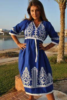 This beautiful bohemian embroidered tunic dress is surely going to add life and oriental charm to your closet. The dress is made of Egyptian cotton which is widely renowned for its quality and texture. The dress is light and extremely soft and can be used on many occasions - beach, lounge, or even in your home to feel comfortable. Fabric : 70% Egyptian Cotton; 30% Polyester. Tunic measurements in inches : Small (Size 4/6 USA) Bust : 36-37 Hip : 40-41 Medium (Size 8/10 USA) Bust : 39-40 Hip : 45- Intricate Embroidered Tunic Dress For Festivals, Cotton Tunic Dress For Eid, Bohemian V-neck Kurta With Intricate Embroidery, Cotton V-neck Dress With Resham Embroidery, Traditional V-neck Dress With Embroidered Border, Traditional Tunic Dress With Embroidered Border, Folk Style Chikankari Embroidery Dress For Eid, Folk Style Tunic Embroidered Dress, Folk Style Embroidered Tunic Dress