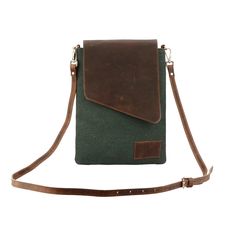 About this item Compact Sling Bag/ Shoulder/ Crossbody bag for spontaneous city trips and small adventures made of canvas and leather. - Handcrafted from genuine buffalo leather - Perfect storage for mobile phone, wallet and valuables - Inside and outside: 1 zipped compartment inside - Scope of delivery: 1 bag, 1 shoulder strap  Color: Green Weight: 0.125 kg Dimensions in cm (H x L): 15x10 Material: cotton (canvas) and buffalo leather (vegetable tanned), brass metal parts Unisex Sling Bag, Brown Mobile Phone Bag For Outdoor Activities, Canvas Satchel With Mobile Phone Bag, Canvas Satchel With Mobile Phone Pocket, Canvas Satchel Mobile Phone Bag, Canvas Crossbody Mobile Phone Bag, Leather Pouch Bags For Outdoor Activities, Travel Canvas Satchel With Mobile Phone Bag, Canvas Crossbody Shoulder Bag With Cell Phone Pocket