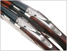 four different types of shotguns lined up on top of each other in silver and wood