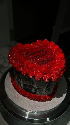 there is a cake that has been decorated with red icing on the top and bottom