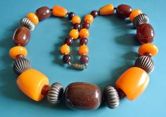 "Rare unique one-of-a-kind vintage 1980s necklace choker with oval brown resin plastic, rifled brass and jucey yellow catalin plastic beads - seamless beads on this necklace. Size:    23.5 \"/ inch or 52 cm long. Brass barrel clasp. Weight 104 gram. Exellent  vintage condition." 1980s Necklace, African Trade Bead Jewelry, African Trade Beads, Trade Beads, Necklace Size, Necklace Choker, Bead Jewelry, Plastic Beads, Sweden