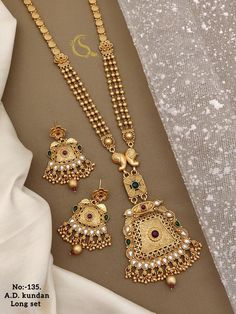 Description :- Indian necklace look like real gold /Gold Necklace /Matar Mala/Long Gold necklace/Indian jewelry/Pakistani jewelry/Beaded Chain Gift yourself a royal look with this perfectly crafted kundan necklace set from Manalisstudio. Crafted with high quality kundan stones and pearls, it is impressive in design. The green enamel artwork adds perfect texture to the design. Perfect for weddings and festivities, this antique necklace set should be put on with your favorite sari or lehenga. 100% Luxury Gold Temple Jewelry Mala, Gold Mala Designs Antiques, Long Gold Necklace Indian, Long Gold Necklace, Jewelry Pakistani, Gold Necklace Indian, Necklace Indian, Indian Necklace, Gold Long Necklace