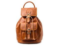 This More Freedom backpack  is designed for the modern on-the-go woman who seeks elegance as well as practicality. It is made to create a sharp and powerful fashionable impact with an incredible amount of space and compartments, which can carry all our valuables. It also features a natural lining, and closure with leather cords, while the comfortable shoulder straps make this perfect for all-day wear. Honey Brown, Backpack Tote Bag, Leather Shops, Leather Items, Lining Fabric, Tote Backpack, Vegetable Tanned Leather, Leather Cord, Cleaning Clothes