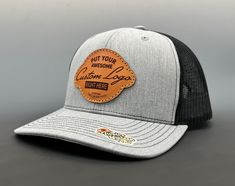 "Genuine leather, laser engraved, hand dyed - hand conditioned - hand stitched, onto the highest quality trucker hats. See below for ordering instructions. Current custom hat processing time is one to two weeks. **NEW** Add a TwelveSixteen shirt to your order! Made by us, in house. See our store for the listing. How to Order - Youth and XL sizes available on drop down - Please note this items processing time prior to ordering. - From the photos, select your hat color (add one of each color you w Custom Hat With Leather Patch And Flat Bill, Custom Flat Bill Hat With Leather Patch, Custom Adjustable Trucker Hat With Leather Patch, Custom Trucker Hat With Leather Patch Snapback, Custom Trucker Hat With Leather Patch, Custom Snapback Trucker Hat With Leather Patch, Custom Baseball Cap With Curved Brim, Custom Flat Brim Baseball Cap, Adjustable Leather Six-panel Trucker Hat