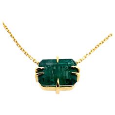 3.50ct Lustrous forest green Emerald cut Emerald set in fierce claws in 18ct yellow gold with 40cm 18ct yellow gold chain. Zambian emerald Emerald cut 18k gold 40cm 18k chain Ohliguer signature claws Ready to ship in gift box Comes with valuation* *Different sizes available please see other listings or contact our concierge team to view our in stock emeralds so we can customise your peice* ABOUT THE BRAND Once shrouded in mystery, the story of Ohliguer emerged from the not-too-distant past. A great grandmother married to the last Tsars cousin, presented to King George V, King Edward VII, Queen Mary and Queen Alexandra and regularly dined with the infamous Rasputin. Her father supplied jewels the size of reptilian eggs from his mines in the Ural Mountains to the royal family and the most re Luxury Faceted Emerald Cut Jewelry, Luxury Faceted Emerald Jewelry, Faceted Emerald Cut Emerald Jewelry, Octagon Emerald Gold Jewelry, Luxury Yellow Gold Emerald Necklace With Prong Setting, Yellow Gold Emerald Jewelry With 17 Jewels, Yellow Gold Emerald Pendant Necklace With Prong Setting, Gold Emerald Jewelry With Diamond Cut, Yellow Gold Necklace With Emerald And Polished Finish