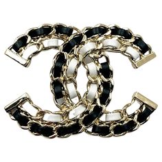 Chanel Brand New Gold CC Black White Leather Chain Large Brooch *Marked 22 *Made in Italy *Comes with the original box, pouch, booklet, camellia and ribbon *Brand New – It is approximately 2″ x 2.75″. 10260-8202 Scarf On Bag, Chanel Brand, Box Pouch, Gold Branding, Leather Chain, White Leather, Gold Hardware, Original Box, Black Leather