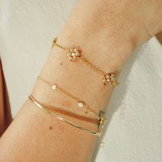 Elevate your style with our chic Daisy Bracelet, completely handmade in gleaming gold filled and pearls. Each piece is meticulously crafted, ensuring dainty elegance in every detail. Handcrafted in USA DETAILS: Sold by one bracelet Water Resistant- Skin FriendlyMaterial: 14k gold filledShell Pearls+ 1 inch of extender chain Personalized Cuff Bracelets, Daisy Bracelet, Beaded Cuff, Gold Filled Ring, Gold Filled Earrings, Dainty Bracelets, Brides And Bridesmaids, Chain Choker, Cuff Bangles