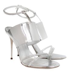 Giuseppe Zanotti's "Mistico" Sandals Will Ground A Myriad Of Looks. Crafted From Metallic Mirror-Leather, This Pair Has An Alluring Silhouette. Their Versatile Silver Hue Will Work Seamlessly With Everything From Monochrome Tailoring To Printed Dresses. - Color: Silver Metallic - Brand New In Box - Open Toe - Adjustable Crystal Embellished Ankle Strap - Mirror Leather - Heel Height: 100mm - Made In Italy Giuseppe Zanotti Heels, Zanotti Shoes, Giuseppe Zanotti Shoes, Black Pumps Heels, Pumps Heels Stilettos, Black Stilettos, Classic Heels, Printed Dresses, Wood Heel