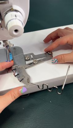 someone is using a sewing machine to sew something