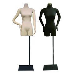 two mannequins are standing next to each other on black stands with white tops