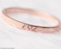 Minimalist wedding band , womens wedding band engraved with your desired initials symbols or words... 14k solid rose gold ring will stay with you forever in same condition.Express your unique and elegant style with your wedding band ♡ Also makes a perfect personalized gift for her...We design this engraved ring as a simple but stylish piece which can match perfectly with other jewelry. Please let us know if you want any custom requests for this wedding ring. ► FEATURES; Band width: 2mm Material Initial Engraved Ring, Stackable Engraved Rose Gold Ring For Anniversary, Anniversary Stackable Engraved Ring In Rose Gold, Anniversary Rose Gold Stackable Engraved Ring, Personalized Rose Gold Stackable Rings With Round Band, Personalized Rose Gold Stackable Rings, Customizable Rose Gold Promise Rings, Rose Gold Stackable Promise Ring Engraved, Stackable Engraved Rose Gold Promise Ring