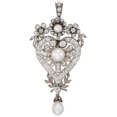 A Victorian diamond and pearl pendant, the central pearl within a diamond heart surmounted by floral motif in pearl and diamond, a pearl drop to base suspended by diamond foliate decoration, convertible to a brooch, the diamond set in silver and mounted on gold, circa 1890, gross weight 15.5g. This exquisite late nineteenth century pendant comes from the collection of Bentley & Skinner, the London jewellers by appointment to both Her Majesty the Queen and His Royal Highness the Prince of Wales. This piece features a heart shaped central plaque set throughout with a dazzling array of old-cut diamonds. At the centre of the heart is a lovely natural pearl, and surrounding the heart are floral and foliate decorations set with further diamonds. The pendant culminates in a wonderful glowing pear Piccadilly London, Victorian Pendant Necklace, Pearl Diamond Jewelry, Victorian Pendants, Edwardian Jewelry, Diamond Brooch, Pearl Brooch, Victorian Jewelry, Yellow Gold Pendants