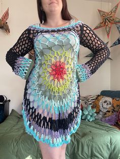 The Flower Child Pullover is a design by Morale Fiber and created by yours truly. Made with 100% cotton yarn in a rainbow color scheme. Fits size small-medium and pictured on a 35 inch bust. A flair style dress, it can be layered over other dresses or a high waisted pant for a flowing, hippie-like look. Measurements  Center from top to bottom: 30.5 inches Shoulder to bottom: 34 inches Sleeve length: 26 inches  Sleeve width: 8 inches at widest point (cuff) Hand/gentle wash cold and air/tumble dry for best results Do not bleach or iron Feel free to message me with any questions or concerns and I'll get back to you as soon as possible. Morale Fiber, Witchy Grunge, Crochet Festival Top, Bohemian Crochet, Flower Children, Crochet Festival, Grunge Vibes, Rainbow Top, Rainbow Sweater