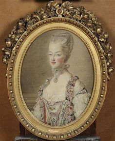 an antique portrait of a woman in white dress