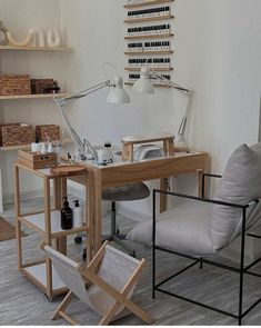 a chair and desk in a room with shelves on the wall behind it, along with other furniture