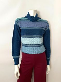 Teal Vintage Sweater, Blue Jacquard Knit Sweater For Fall, Blue Jacquard Knit Sweater, Fitted Blue Turtleneck Sweater, Blue Fitted Turtleneck Sweater, Retro Striped Knitted Sweater, Blue Fitted Textured Knit Sweater, Blue Knit Turtleneck Sweater, Retro Blue Knitted Sweater