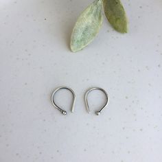 Tiny open hoop earrings made with Sterling silver with a slight aged finish. These handmade huggie hoop earrings are cute and comfortable for daily use, very easy to take off and put on. A pair of small hoop earrings unisex style, perfect for both men and women.  Great as a gift for men, gift for your partner or dad gift, they are a nice gift for on any occasion like birthday or Father's day. All items from Lunahoo arrive beautifully packaged in a gift box. This listing is for a pair of silver o Silver Small Hoop Piercings As Gift, Silver Adjustable Huggie Nose Rings, Sterling Silver Small Hoop Ear Cuff For Everyday, Everyday Small Hoop Sterling Silver Ear Cuff, Minimalist Adjustable Hoop Cartilage Earrings, Minimalist Small Hoop Silver Piercings, Adjustable Hoop Nose Rings For Everyday, Adjustable Hypoallergenic Hoop Wrap Earrings, Hypoallergenic Adjustable Small Hoop Wrap Earrings