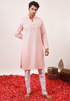 Faux Georgette Kurta in Peach. This Readymade Chinese Collar Neck and Full Sleeve attire is Enhanced with Fancy Buttons, Chikankari, Resham and Sequins Work. Available with a Cotton Silk Aligarhi Pant in White Do note: Footwear shown in the image is for presentation purposes only. Half to one inch may vary in measurement. (Slight variation in actual color vs. image is possible) We sell all kinds of menswear. Mens Kurta | Mens Kurta Pajama | Mens Sherwani | Mens Sherwani Sets | Traditional Menswe Pink Dabka Kurta For Diwali, Pink Sherwani For Diwali And Traditional Ceremonies, Festive Embroidered Peach Kurta, Pink Sherwani With Zari Work For Traditional Ceremonies, Pink Sherwani For Traditional Ceremonies And Eid, Peach Traditional Wear For Navratri With Self Design, Pink Long Sleeve Kurta For Traditional Ceremonies, Festive Peach Traditional Wear With Chikankari Embroidery, Pink Sherwani For Festive Traditional Ceremonies