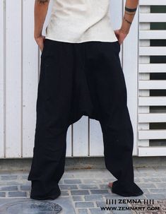 Unisex Alibaba Pants also known as Aladdin pants, Harem or Afgani trousers are very comfy. Unisex. Made from 100% soft khadi cotton with elasticated waist with drawstring. Light and Cozy, suitable for Indoor & Outdoor. No tie Tension with free size waist will give you a smooth and comfortable feeling whole day. Perfect wear for Yoga, Tai Chi and as daily outfit. Size:One fits Small to Medium Color: Black and Grey Wash Care: Hand Wash, cold water, do not soak Khadi is made without any synthet Afgani Trousers, Casual Baggy Harem Parachute Pants, Summer Cotton Relaxed Fit Harem Pants, Summer Relaxed Fit Cotton Harem Pants, Casual Harem Yoga Pants For Summer, Casual Baggy Yoga Trousers, Casual Baggy Wide Leg Yoga Pants, Casual Baggy Wide-leg Yoga Pants, Casual Summer Harem Yoga Pants