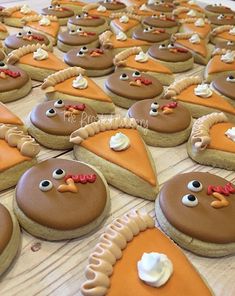 cookies decorated like turkeys are arranged on a table