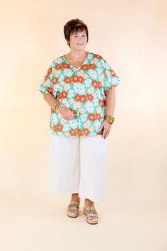 Stay cool and refreshed in this Sunny Refresh Floral V-Neck Top. The lightweight green fabric features bold, contrasting colors of red, blue and pink flowers, while the short sleeves and classic v-neck offer a timeless silhouette. Perfect for any summer occasion. Pair it with Judy Blue Jeans and sandals for a Spring season look! Model: Kristen is wearing a size small. Abby is wearing a size large. Maci is wearing a size 2XL. Nancy is wearing a size 2XL. Size Suggestions and Measurements: Small: Casual Green V-neck Short Sleeve Top, Casual Floral Print V-neck Top For Summer, Relaxed Fit V-neck Top For Spring, Relaxed Fit V-neck Top For Summer Day Out, Spring Beach V-neck Top With Short Sleeves, V-neck Top For Spring And Summer, Cotton V-neck Top For Summer Day Out, White V-neck Top For Spring Vacation, Summer V-neck Top For Day Out